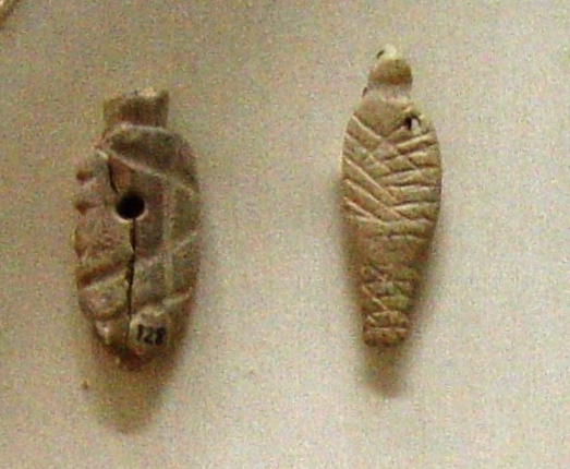 Votive offerings depicting swaddled babies from Agia Triada (Crete), Bronze Age, 2600-2000 BC., Heraklion (Iraklion), Crete. Archeological museum Iraklion By Martin Dürrschnabel - Own work, CC BY-SA 3.0, https://creativecommons.org/